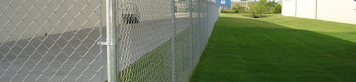 Barbed Wire Fence on green grass